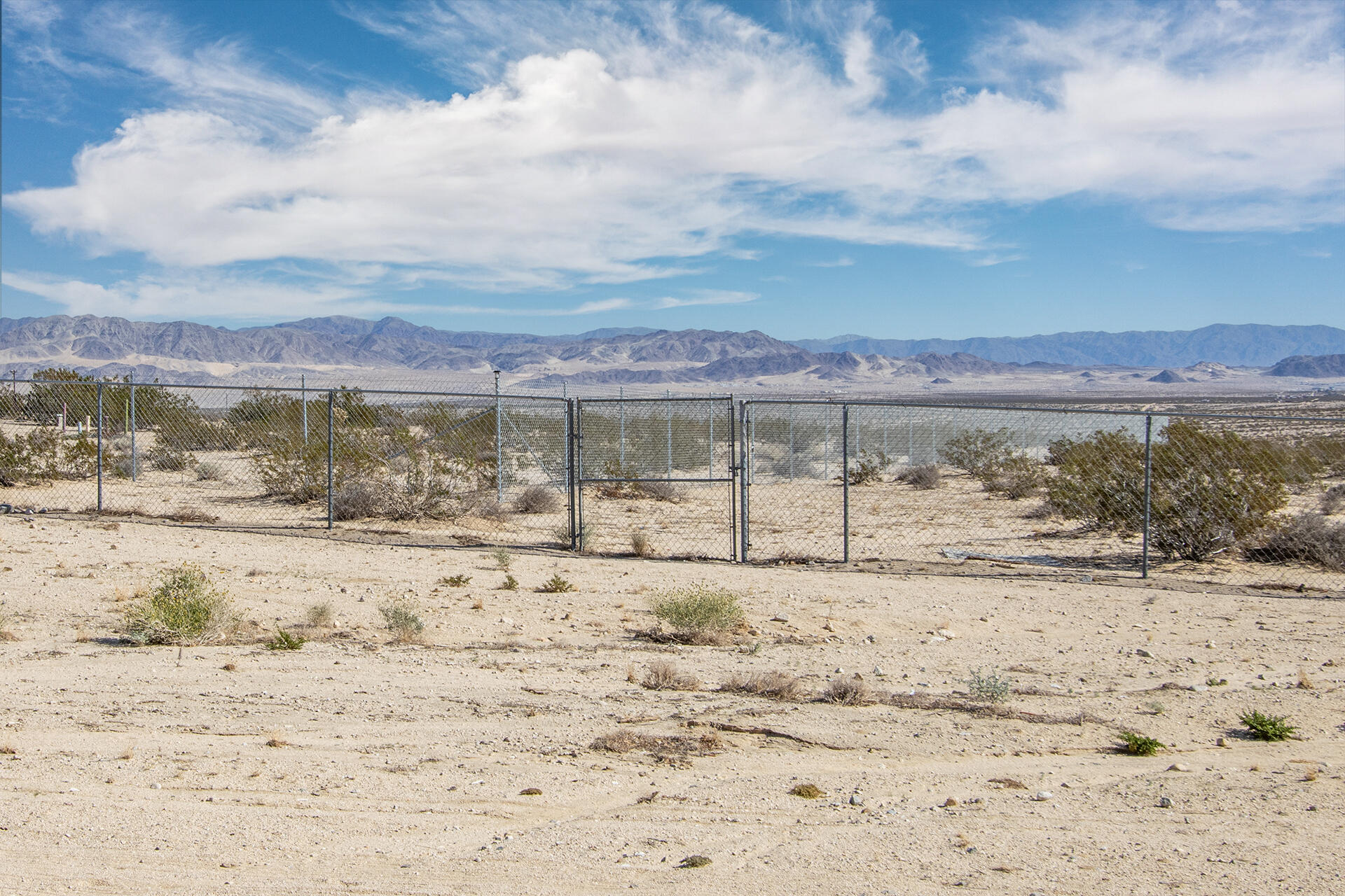 66621 Daisy Lane Joshua Tree, CA 92252 - Photo 19 of 53 a view of yard with ocean and mountain in the background