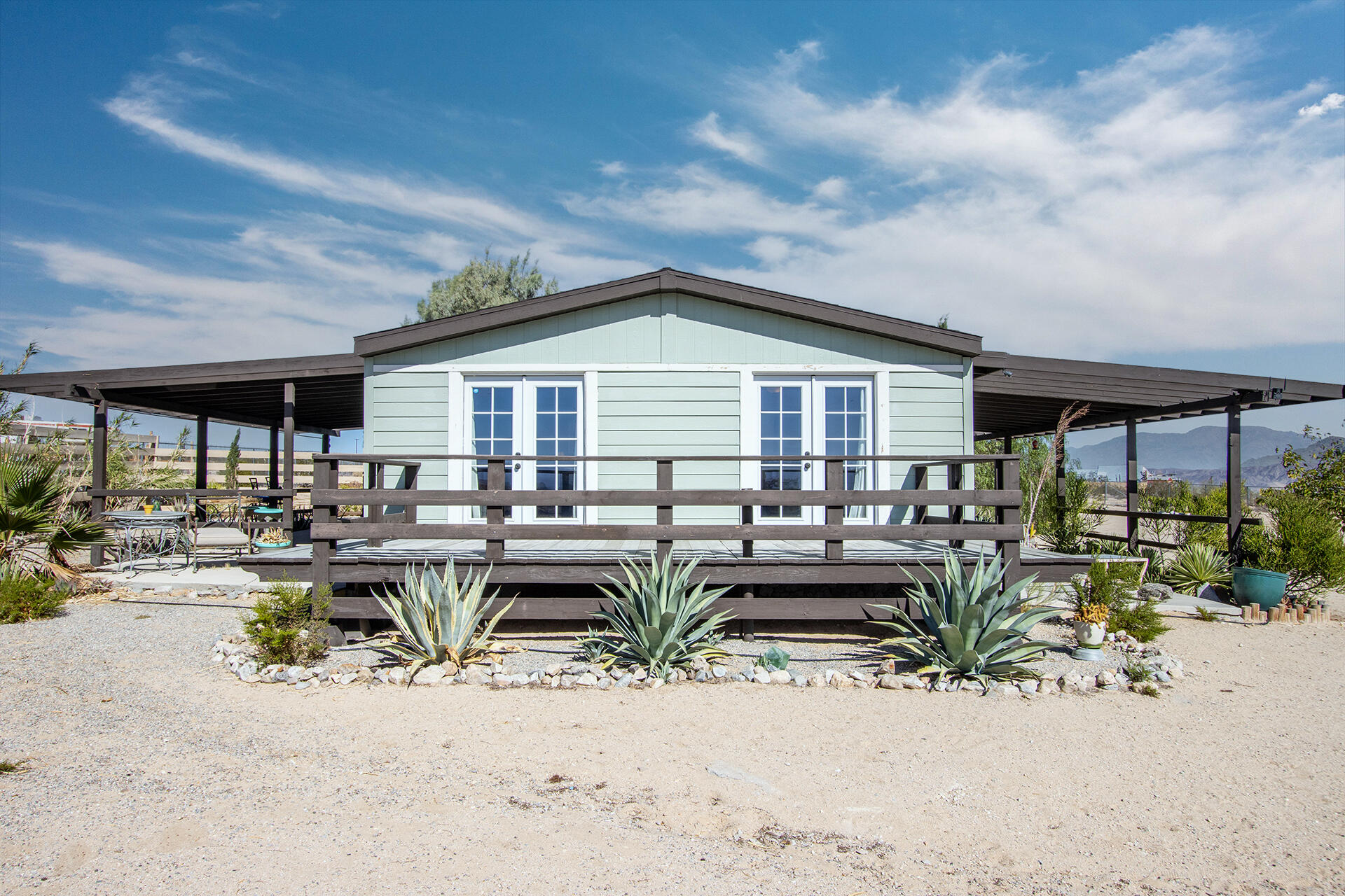 66621 Daisy Lane Joshua Tree, CA 92252 - Photo 25 of 53 a view of a dinning table and chairs in patio