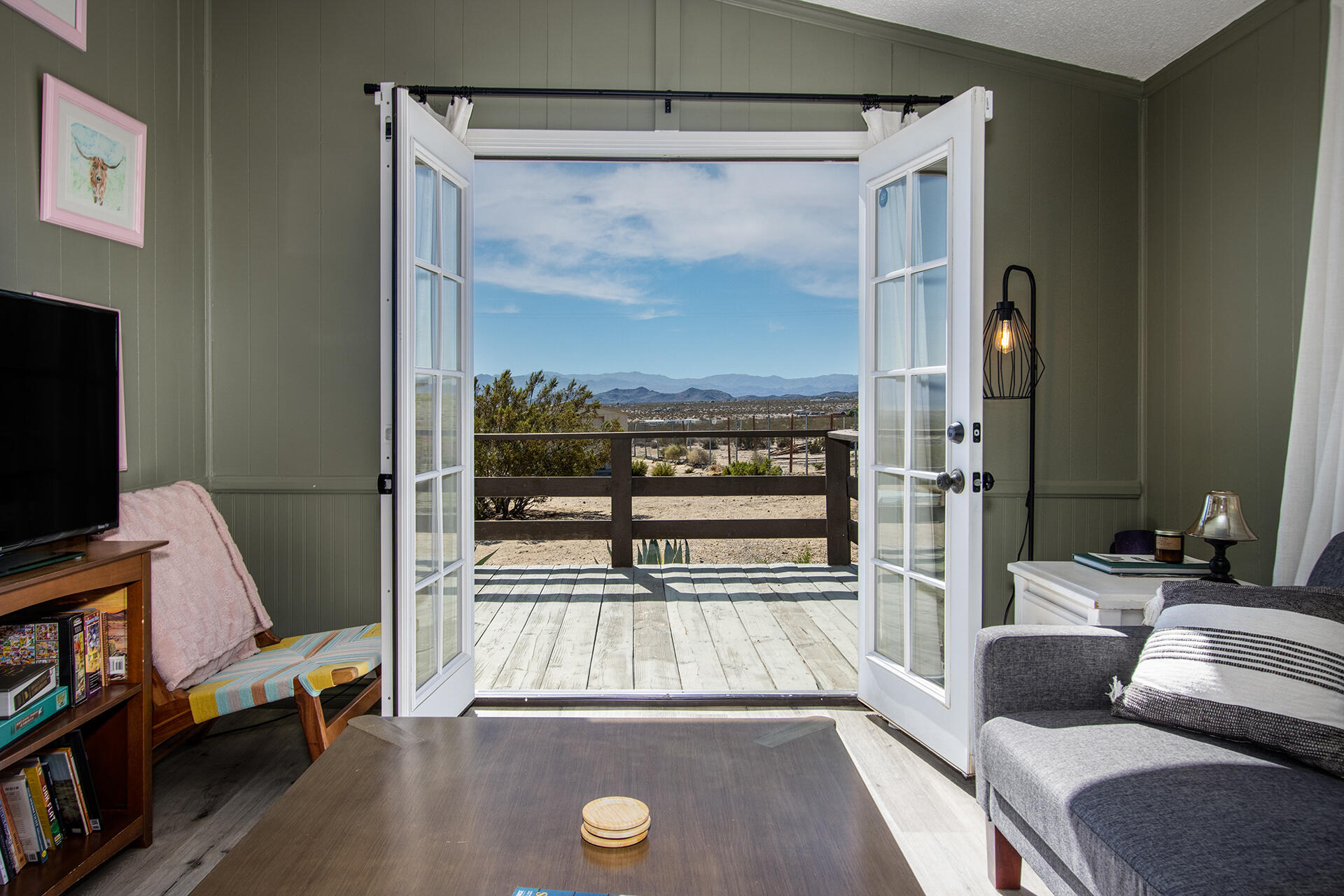 66621 Daisy Lane Joshua Tree, CA 92252 - Photo 32 of 53 a living room with furniture and a flat screen tv
