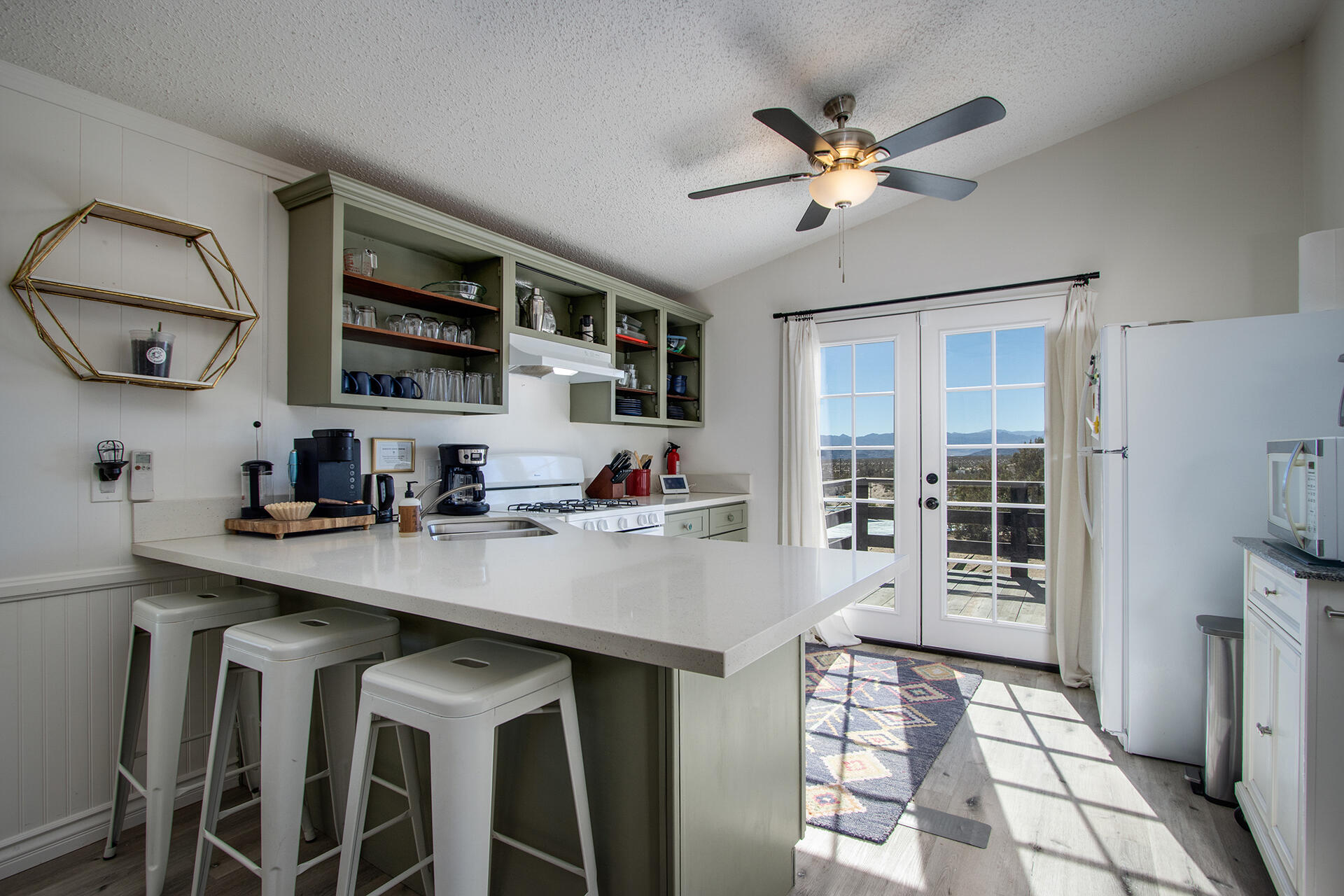 66621 Daisy Lane Joshua Tree, CA 92252 - Photo 35 of 53 a kitchen with a sink a counter and cabinets