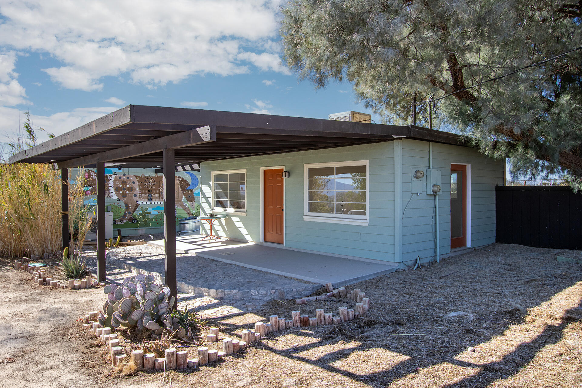 66621 Daisy Lane Joshua Tree, CA 92252 - Photo 49 of 53 a front view of a house with a yard