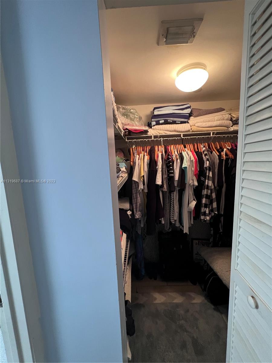 8911 Collins Avenue, Unit 1004 Surfside, FL 33154 - Photo 15 of 20 a view of walk in closet
