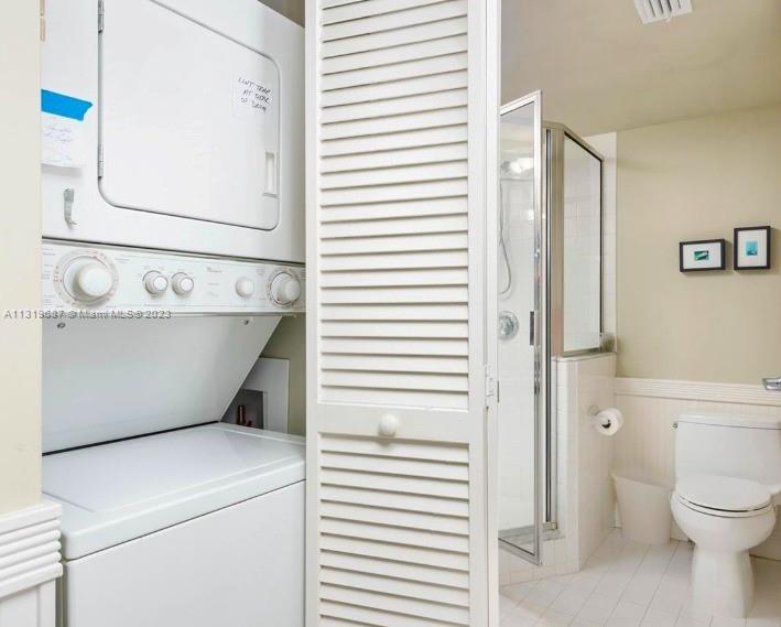 8911 Collins Avenue, Unit 1004 Surfside, FL 33154 - Photo 6 of 20 a bathroom with a sink a toilet and a mirror