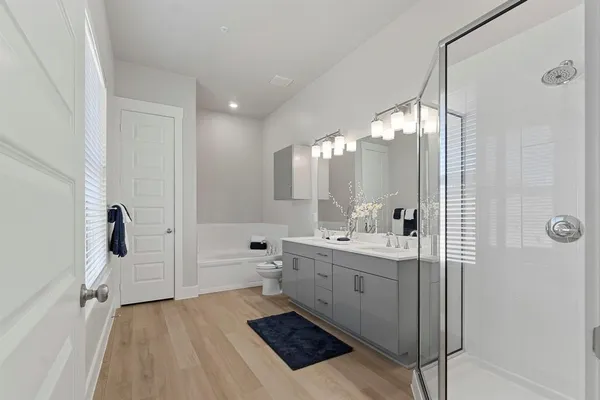 a white toilet sitting next to a bathroom sink