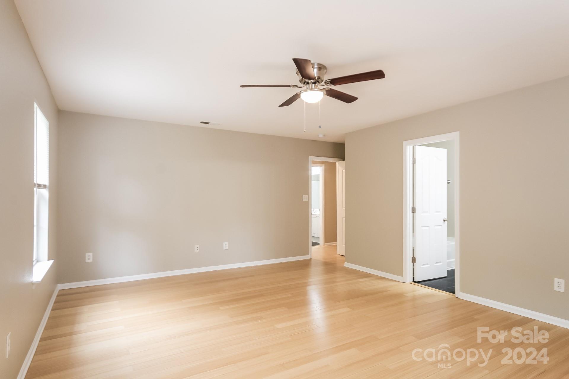 2315 Gooseberry Road Charlotte, NC 28208 - Photo 12 of 22 a view of a livingroom with a ceiling fan and window