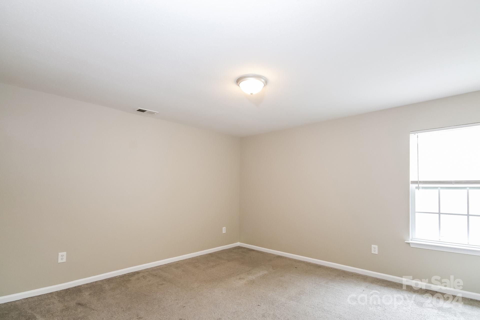 2315 Gooseberry Road Charlotte, NC 28208 - Photo 14 of 22 an empty room with a window