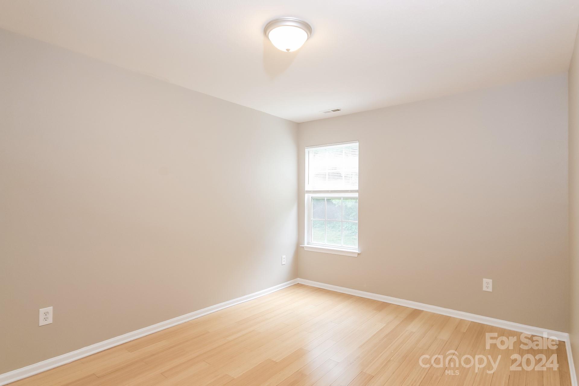 2315 Gooseberry Road Charlotte, NC 28208 - Photo 16 of 22 an empty room with a window