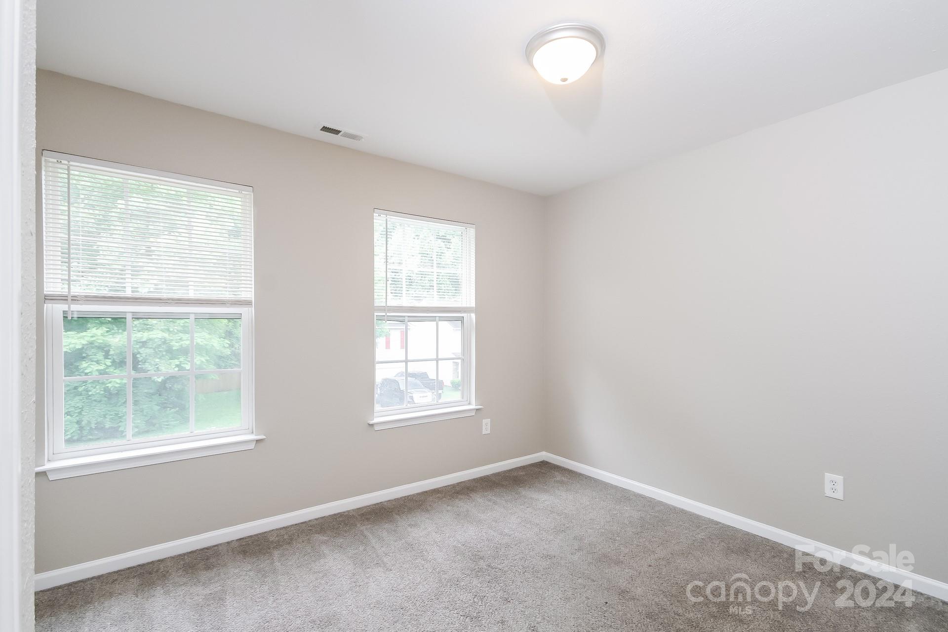 2315 Gooseberry Road Charlotte, NC 28208 - Photo 18 of 22 an empty room with a window