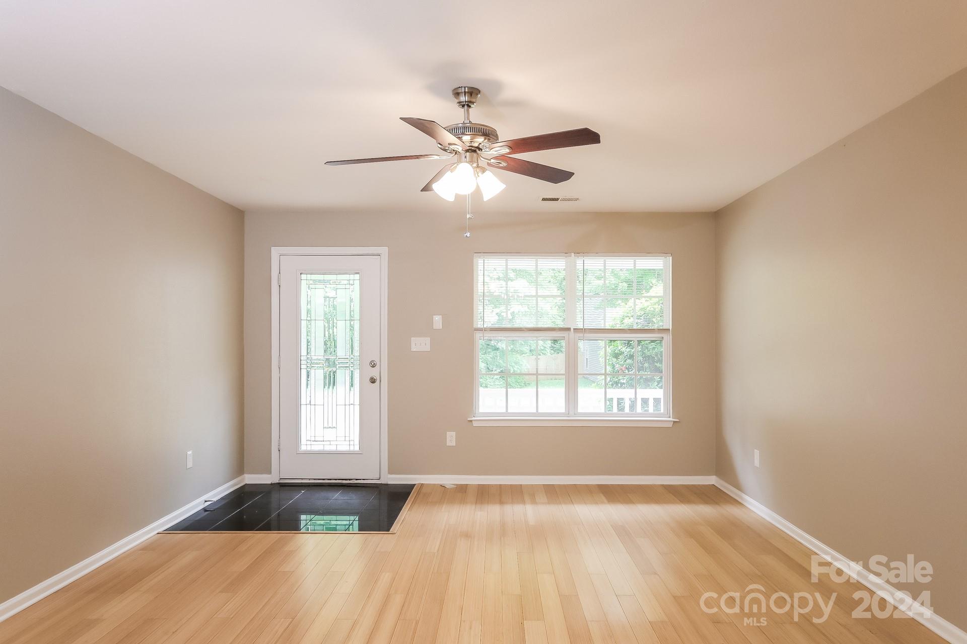 2315 Gooseberry Road Charlotte, NC 28208 - Photo 4 of 22 a view of an empty room with window and a fan