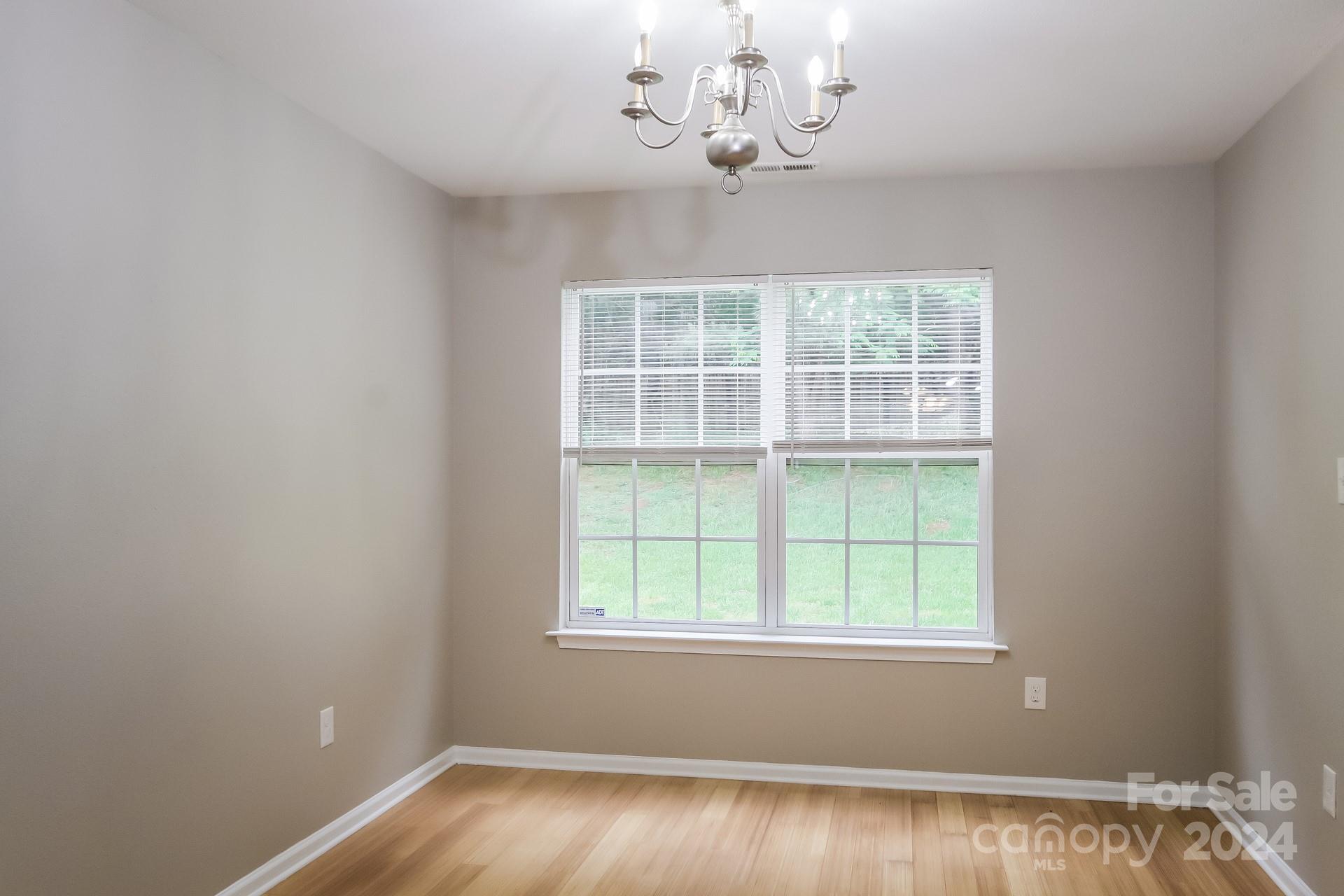 2315 Gooseberry Road Charlotte, NC 28208 - Photo 6 of 22 an empty room with a window