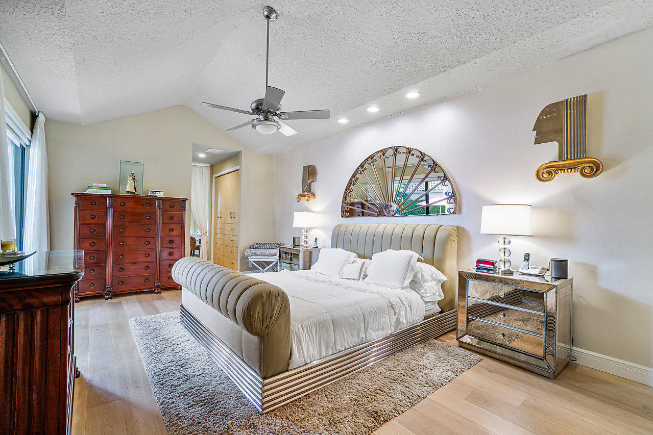 2410 Northwest 53rd Street Boca Raton, FL 33496 - Photo 18 of 25 a bedroom with a bed couch and a window
