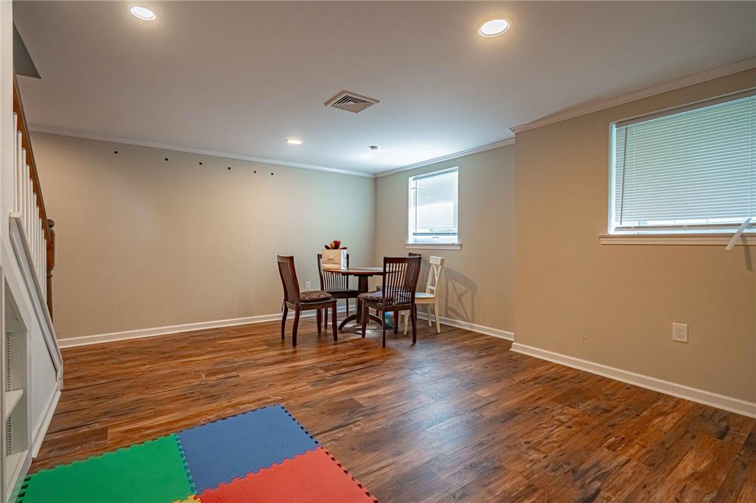 102 Sutton Road Easton, PA 18045 - Photo 58 of 83 Warm wood flooring and recessed lighting define this versatile finished lower-level living space.