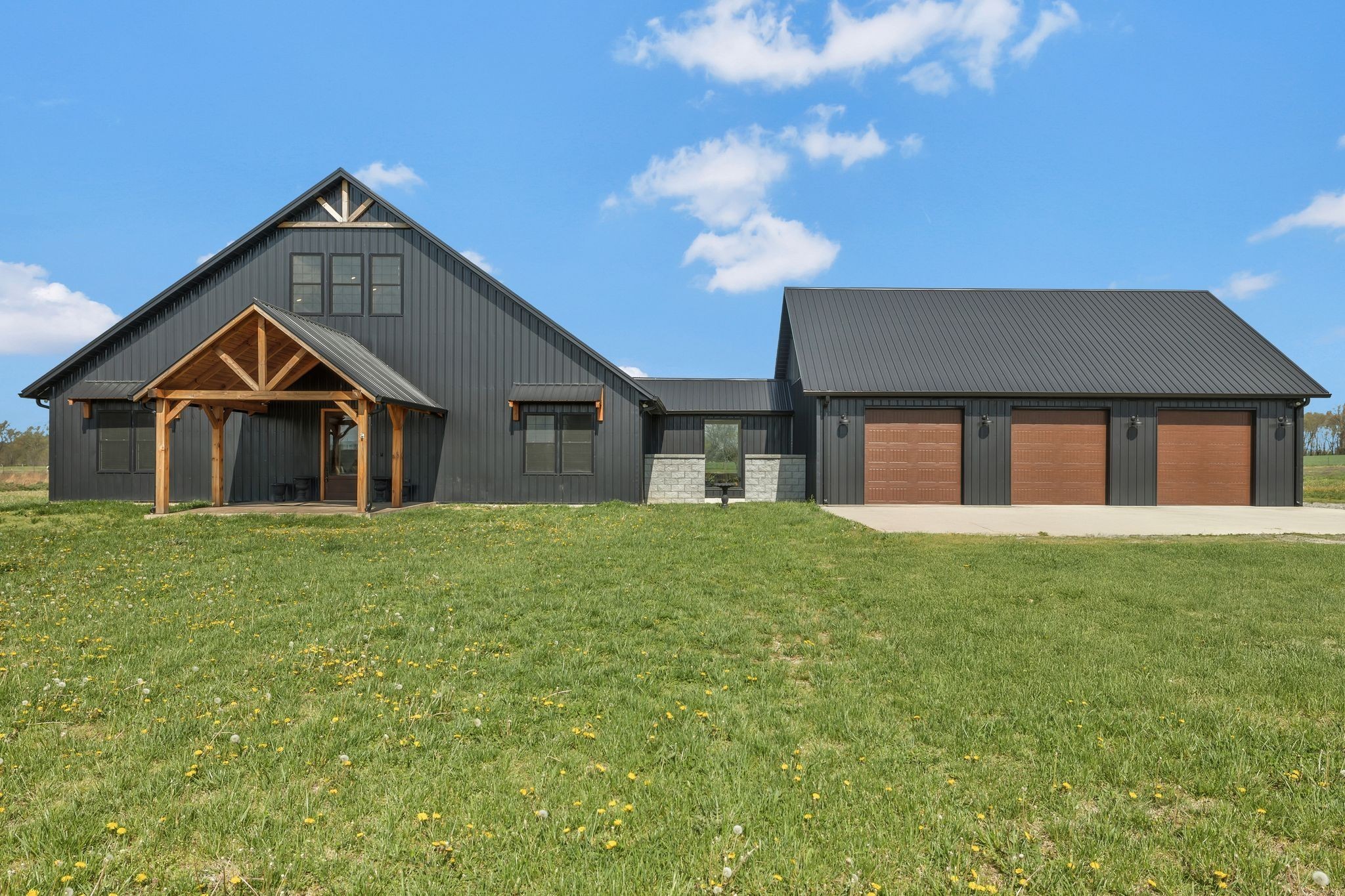 11010 Shelbyville Road Morrison, TN 37357 - Photo 1 of 44 a front view of a house with a garden