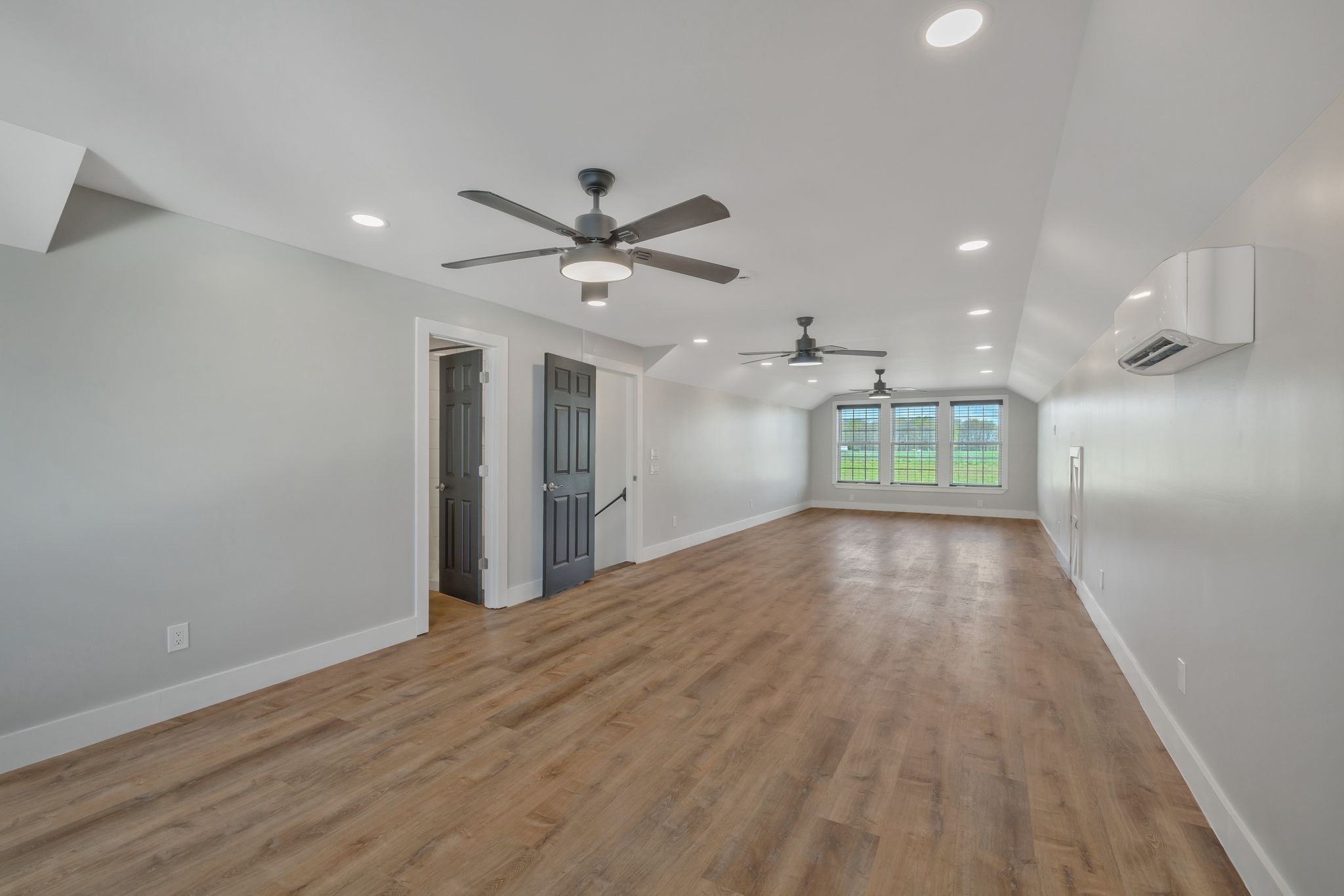 11010 Shelbyville Road Morrison, TN 37357 - Photo 29 of 44 a view of an empty room with window and wooden floor
