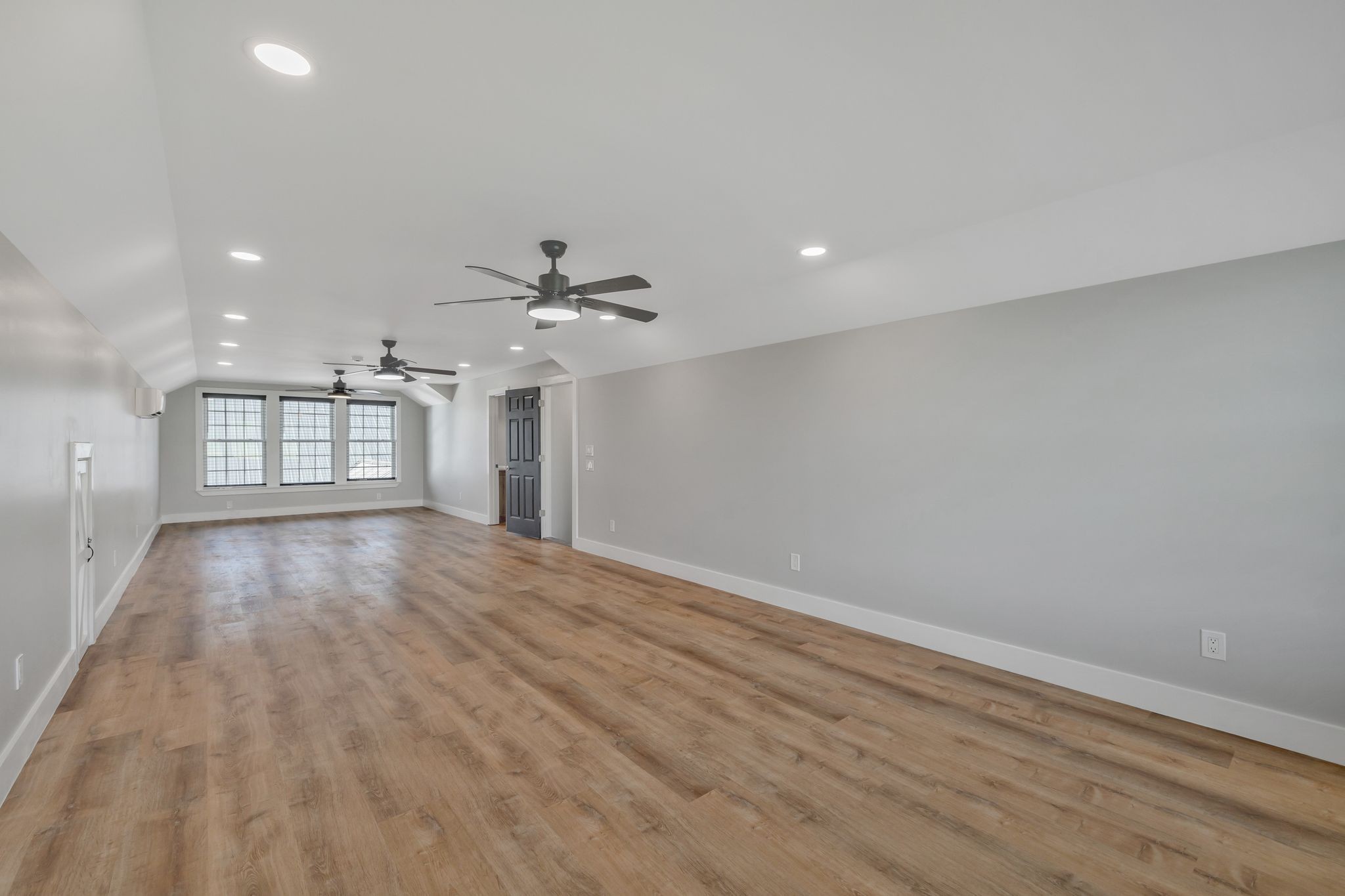 11010 Shelbyville Road Morrison, TN 37357 - Photo 30 of 44 a view of an empty room with a window and wooden floor