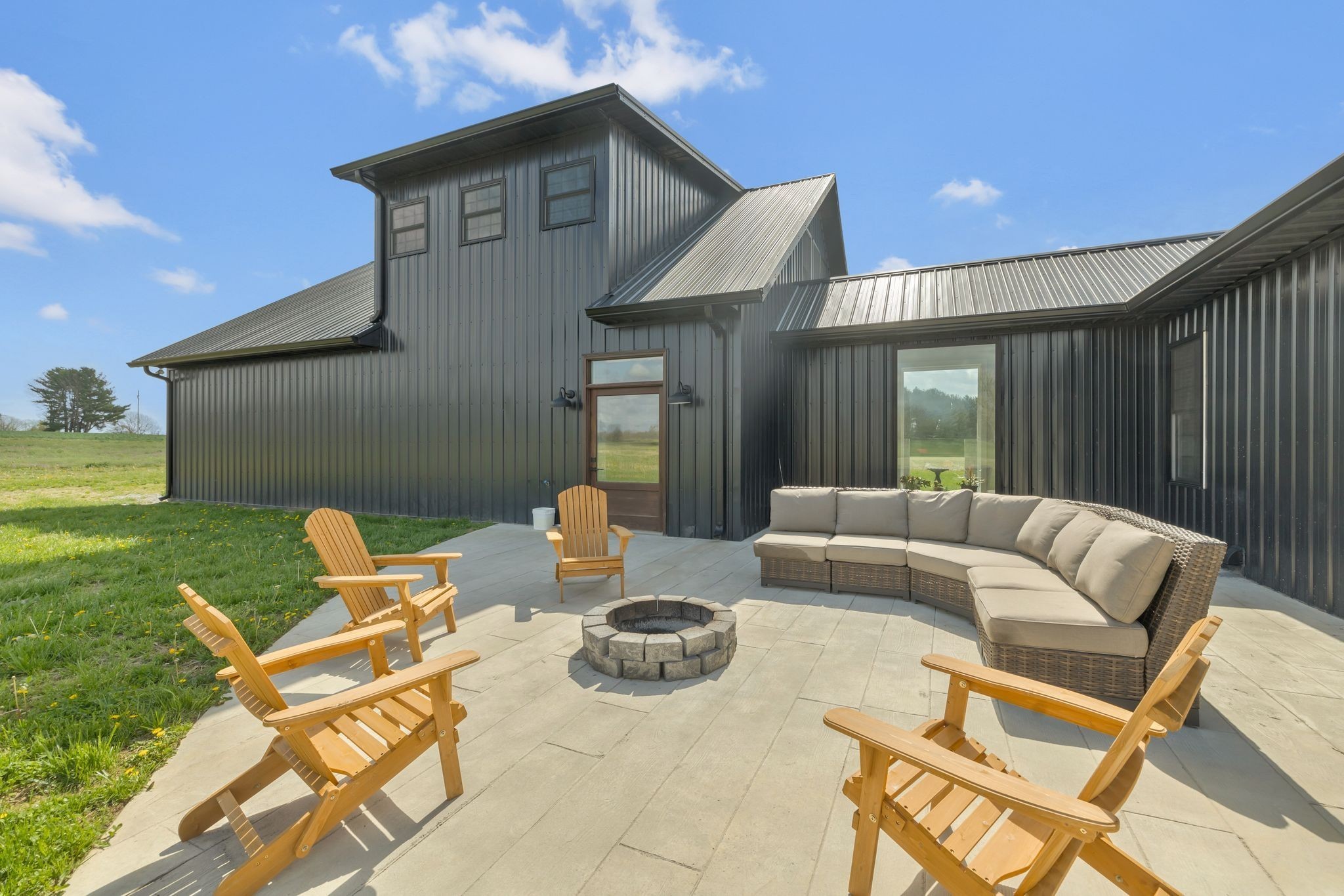 11010 Shelbyville Road Morrison, TN 37357 - Photo 38 of 44 a view of a patio with a dining table and chairs with two barbeque grill