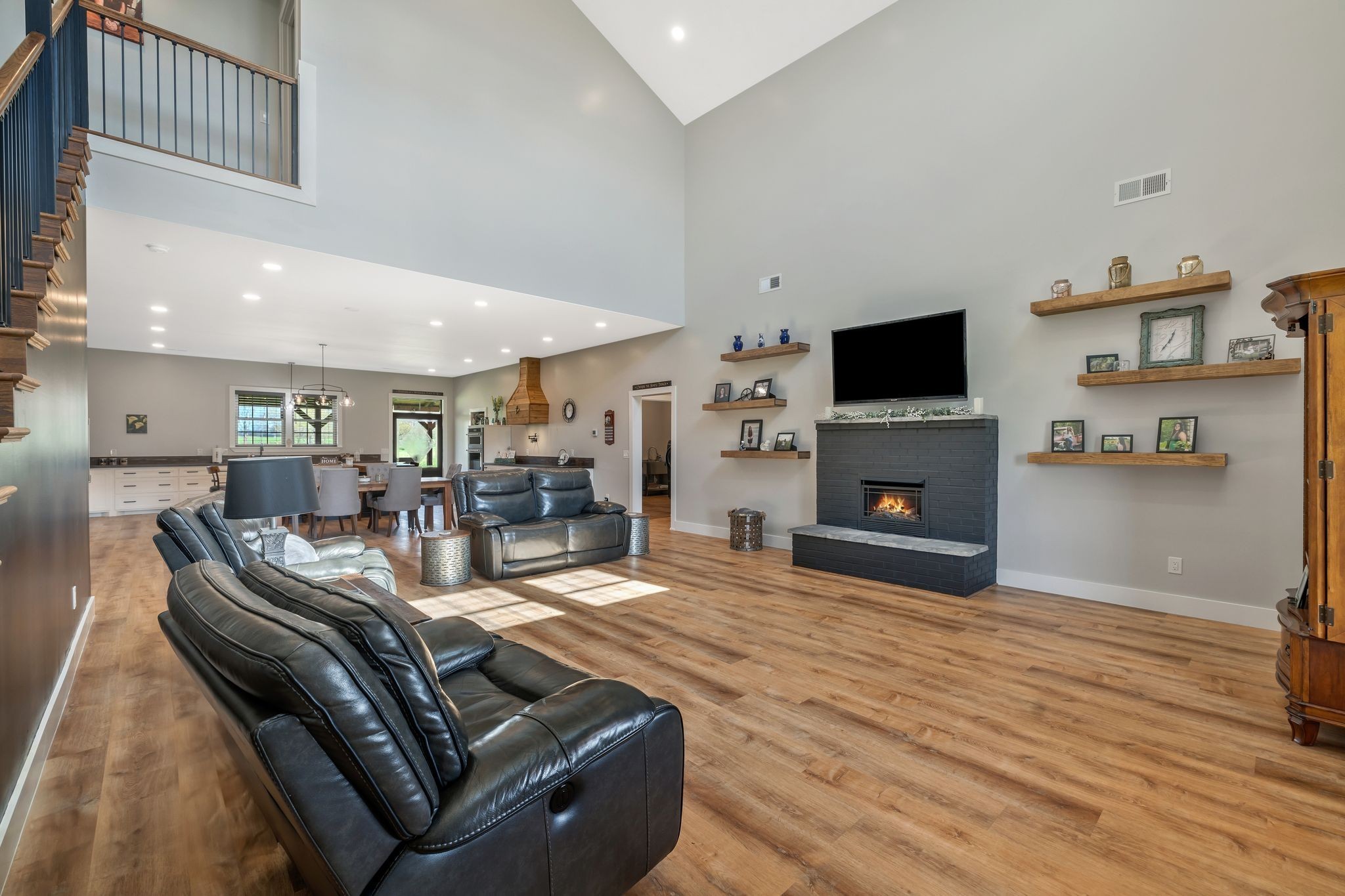 11010 Shelbyville Road Morrison, TN 37357 - Photo 9 of 44 a living room with furniture a fireplace and a flat screen tv