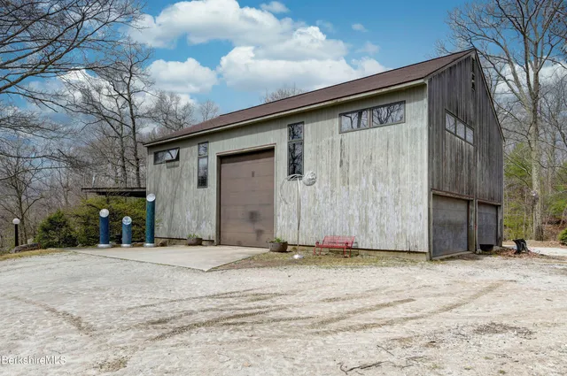 a view of a house with a wooden fence