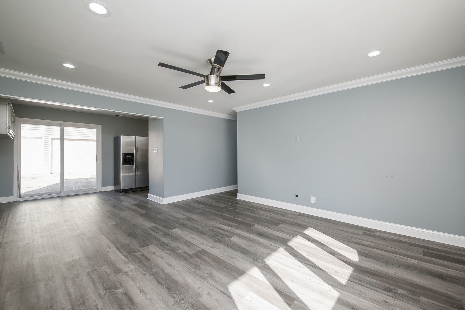 526 White Oak Road Bolingbrook, IL 60440 - Photo 3 of 18 wooden floor in an empty room with a window
