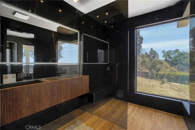 a front view of a house with trees