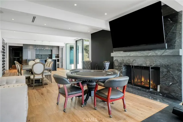 a dinning table and a fireplace in a living room