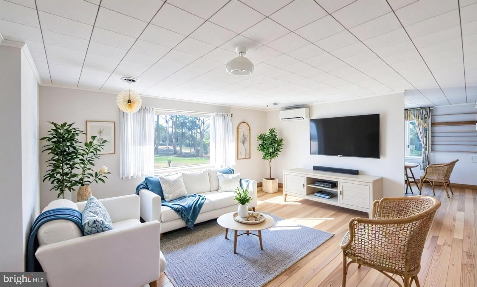 929 North Manor Road Honey Brook, PA 19344 - Photo 14 of 56 a living room with furniture a flat screen tv and a potted plant