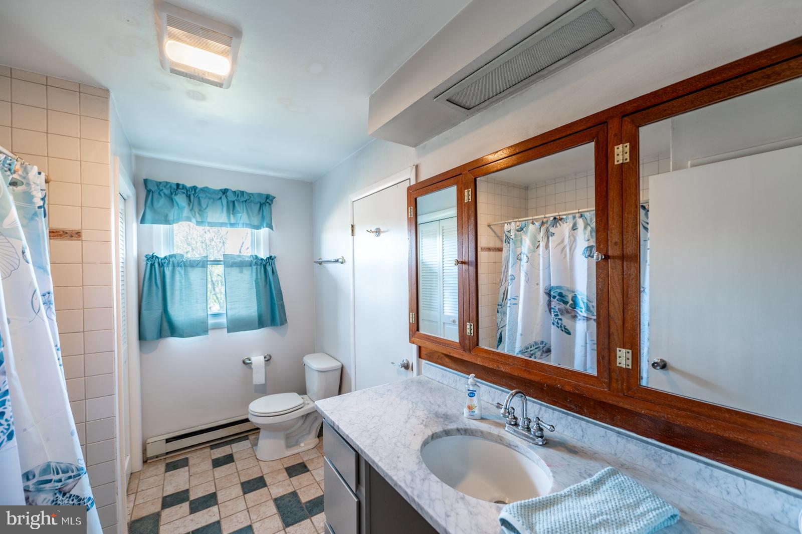 929 North Manor Road Honey Brook, PA 19344 - Photo 16 of 56 a bathroom with a sink a toilet and a mirror