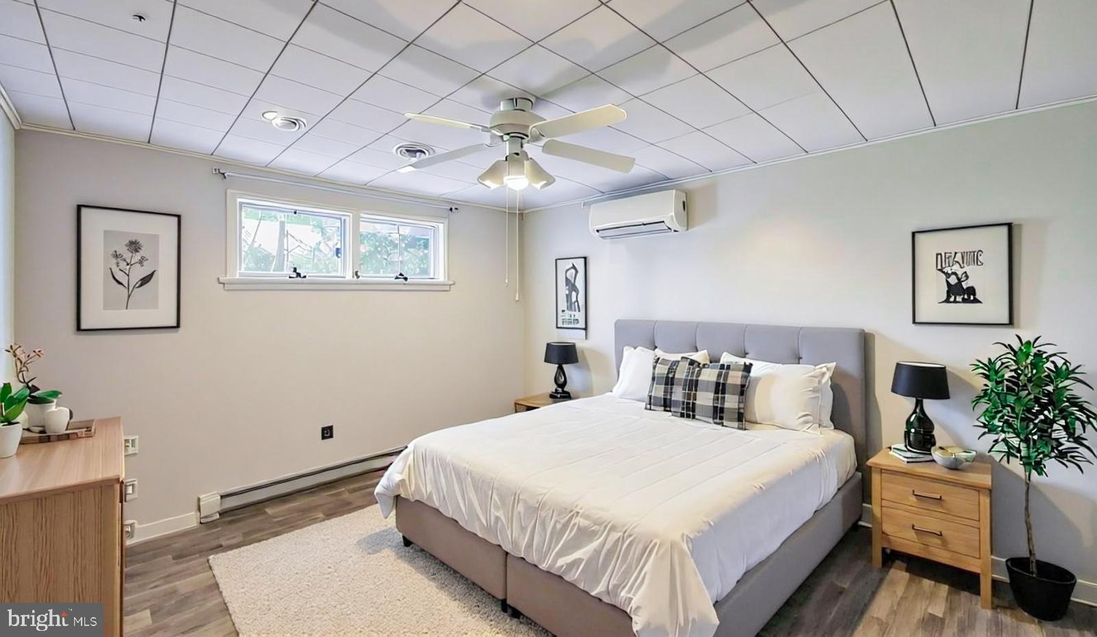 929 North Manor Road Honey Brook, PA 19344 - Photo 20 of 56 a bedroom with a large bed and a chandelier