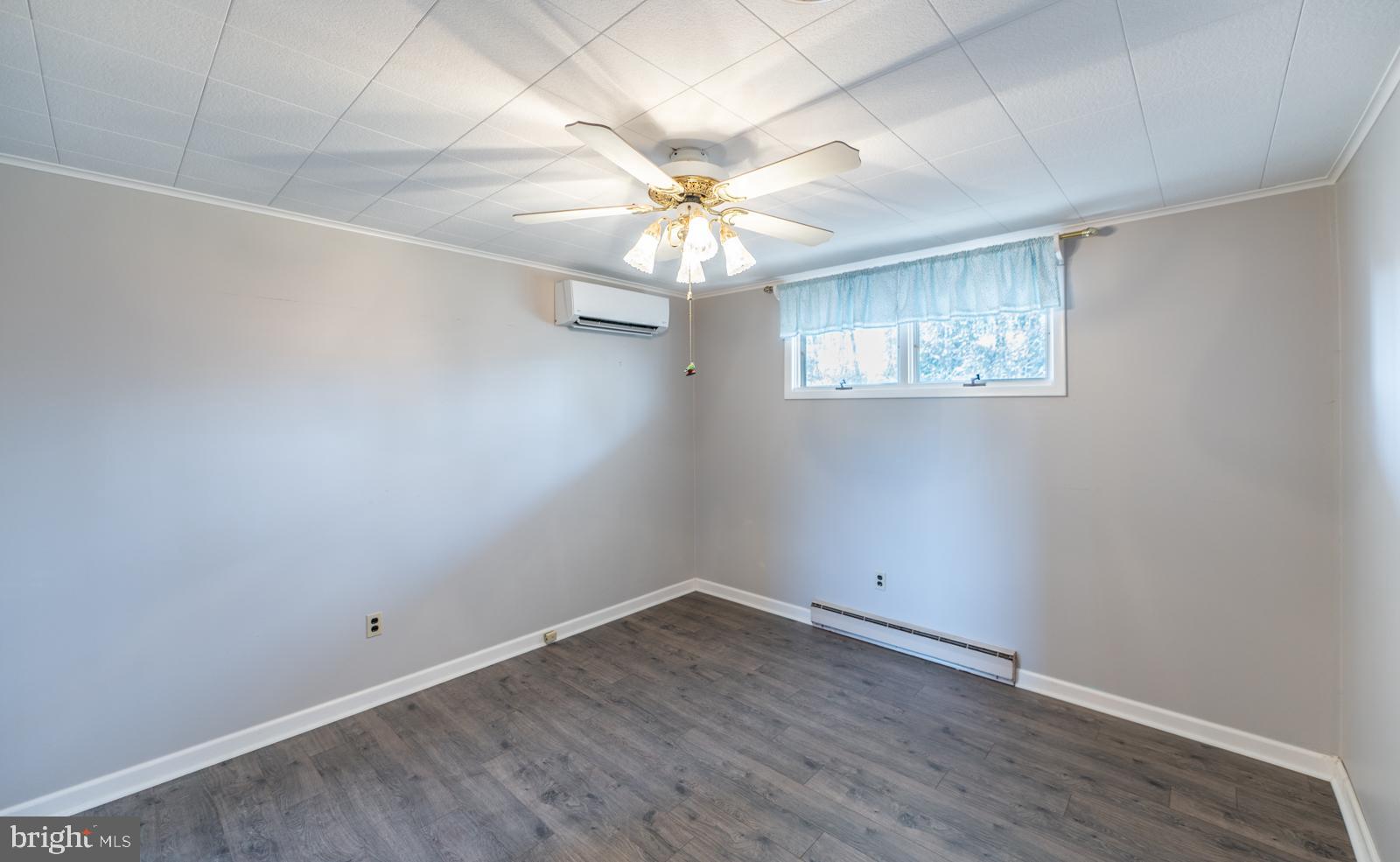 929 North Manor Road Honey Brook, PA 19344 - Photo 22 of 56 wooden floor in an empty room with a window