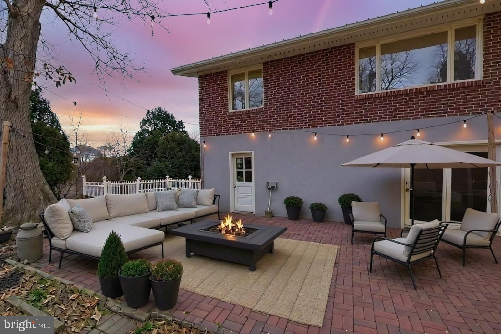 929 North Manor Road Honey Brook, PA 19344 - Photo 34 of 56 a view of a patio with couches and a table and chairs with wooden floor