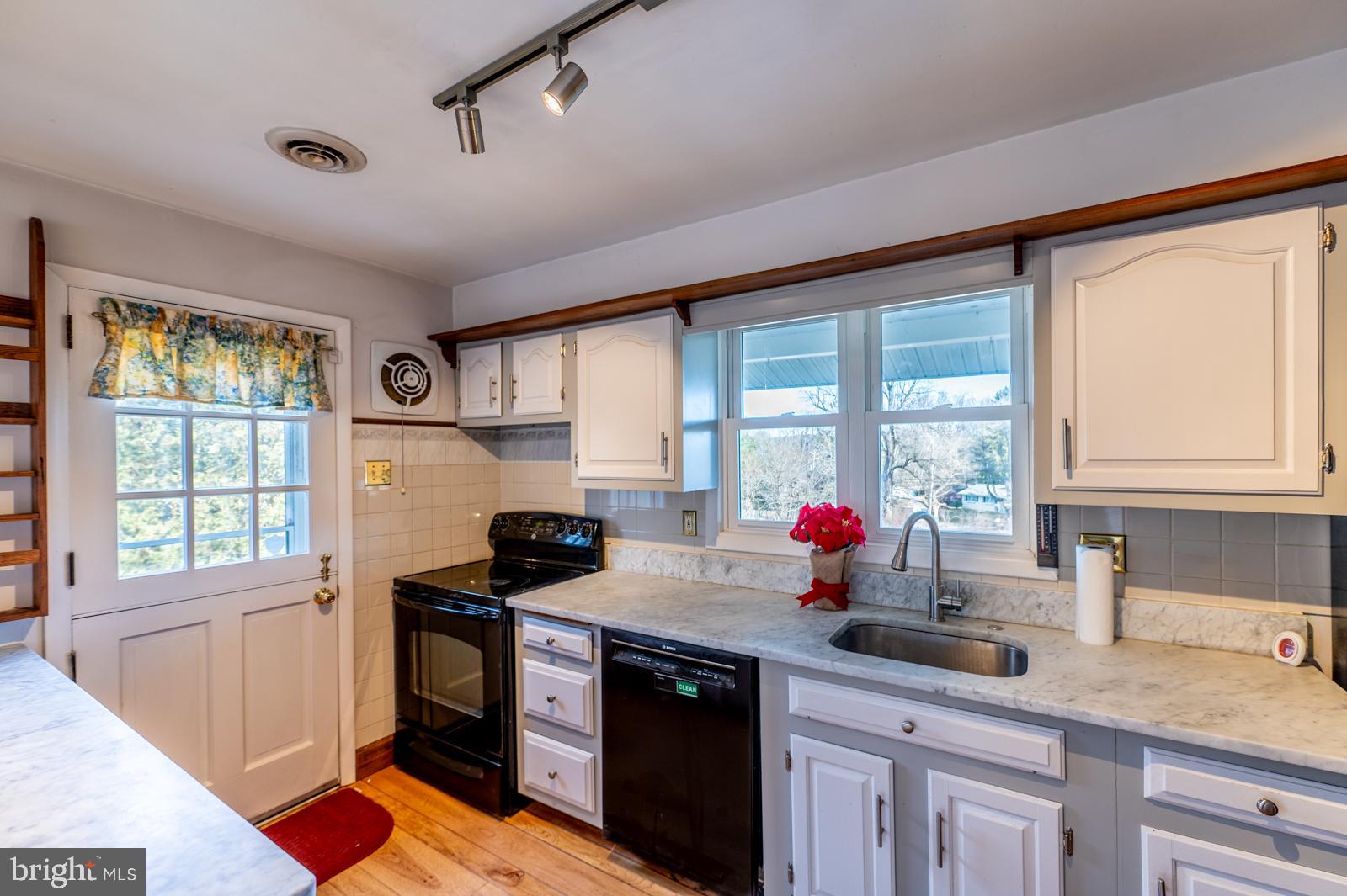 929 North Manor Road Honey Brook, PA 19344 - Photo 8 of 56 a kitchen with sink cabinets and window