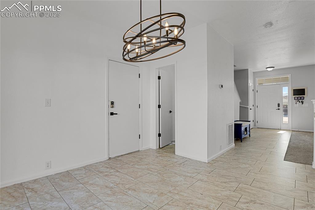 12573 Pine Valley Circle Peyton, CO 80831 - Photo 12 of 36 a view of a hallway with seating area