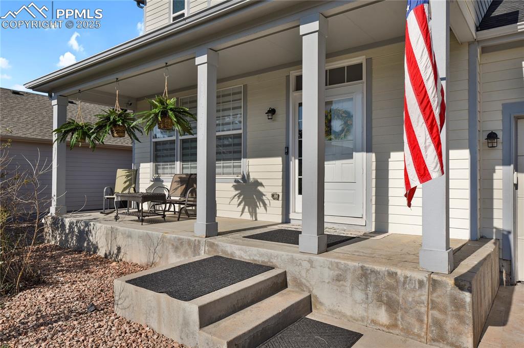 12573 Pine Valley Circle Peyton, CO 80831 - Photo 2 of 36 a view of a entryway door front of house