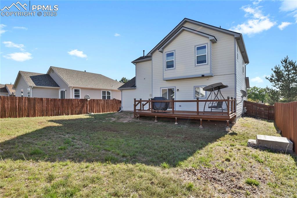 12573 Pine Valley Circle Peyton, CO 80831 - Photo 31 of 36 a view of a house with a yard