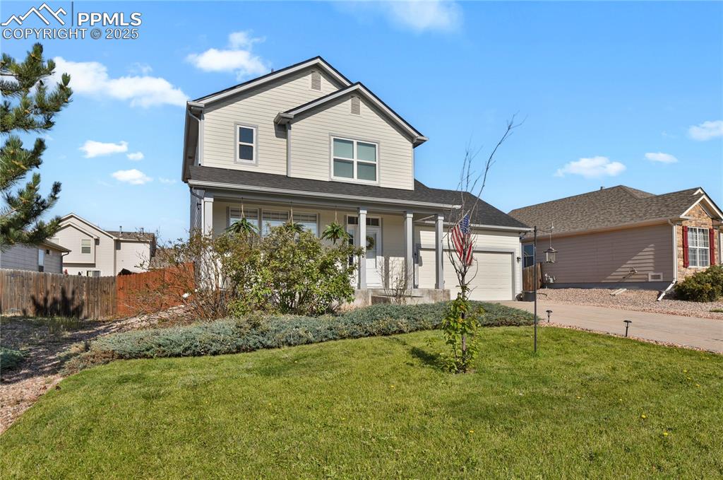 12573 Pine Valley Circle Peyton, CO 80831 - Photo 36 of 36 a house view with a garden space