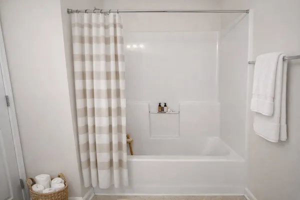 a bathroom with a bathtub and a shower