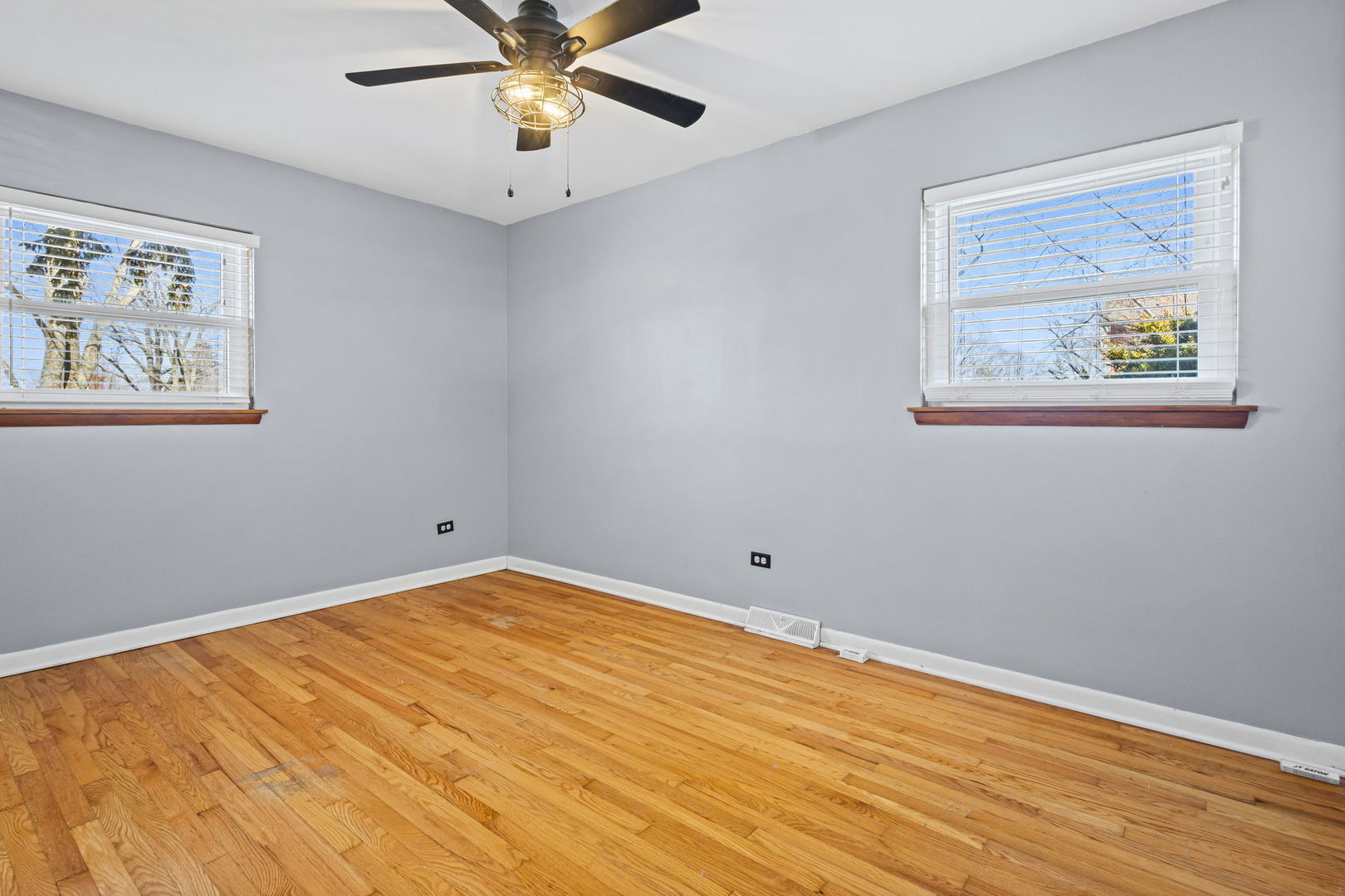 5901 108th Place Chicago Ridge, IL 60415 - Photo 11 of 15 a view of an empty room with a window and wooden floor