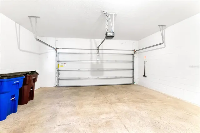 a view of a room with stairs and white walls