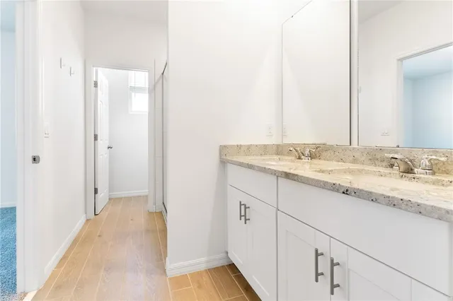 a view of a bathroom from a corridor