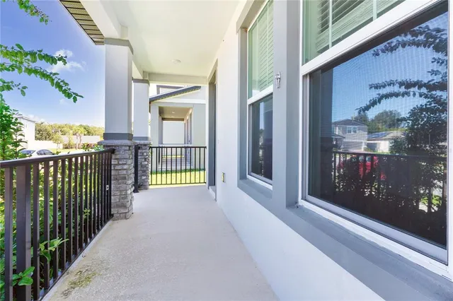 a view of a balcony with wooden floor