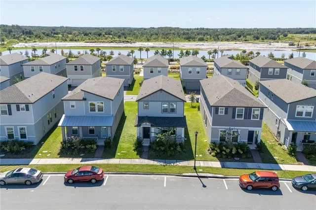 a view of multiple houses with outdoor space