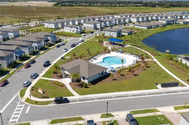 an aerial view of a city with lawn chairs