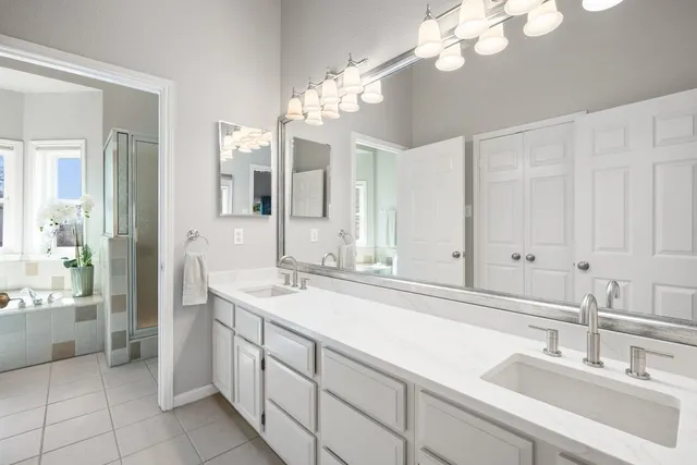 a bathroom with a sink a vanity and a mirror
