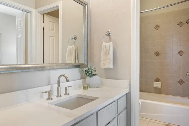 a bedroom with a bed and a television