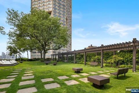 a front view of a building with garden