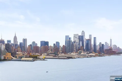 a picture of a room with a white wall and a painting