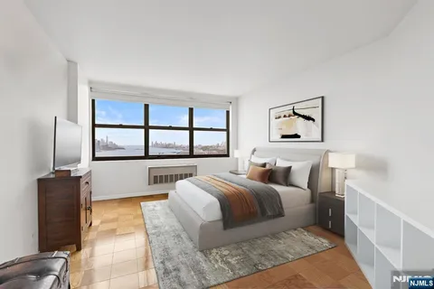 a bedroom with a large bed and a window