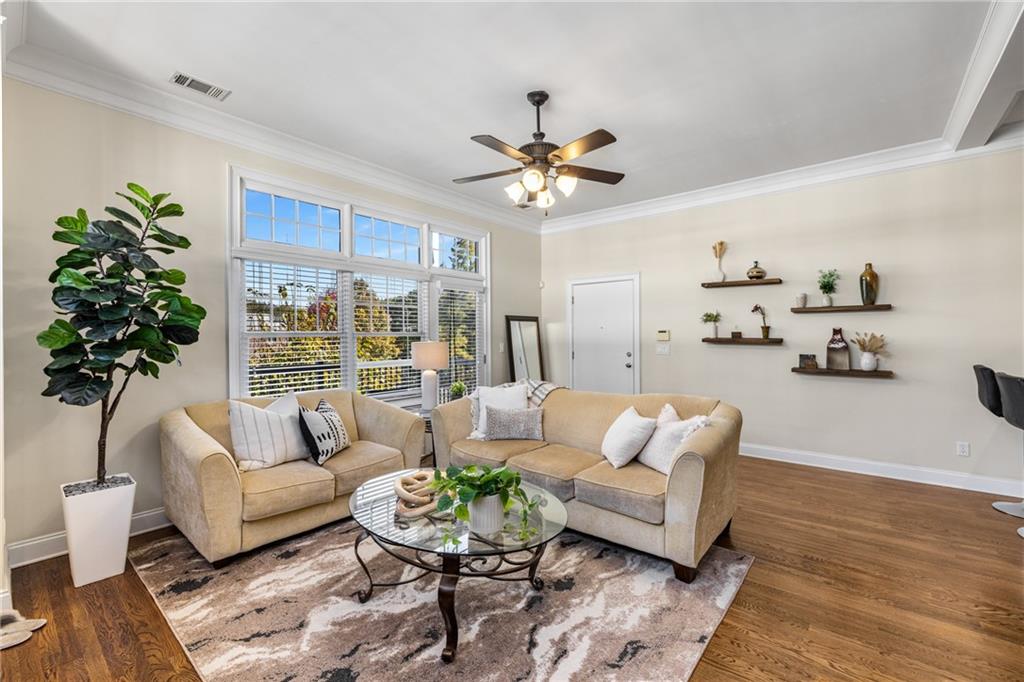 1258 DeKalb Avenue Northeast, Unit 135 Atlanta, GA 30307 - Photo 11 of 45 a living room with furniture or couch and a potted plant