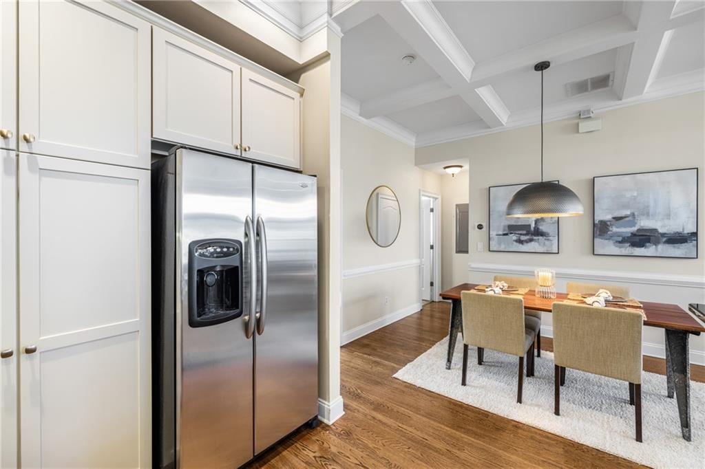 1258 DeKalb Avenue Northeast, Unit 135 Atlanta, GA 30307 - Photo 17 of 45 a kitchen with stainless steel appliances a refrigerator and a table