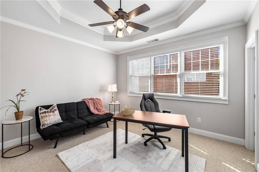 1258 DeKalb Avenue Northeast, Unit 135 Atlanta, GA 30307 - Photo 18 of 45 a living room with furniture and a window
